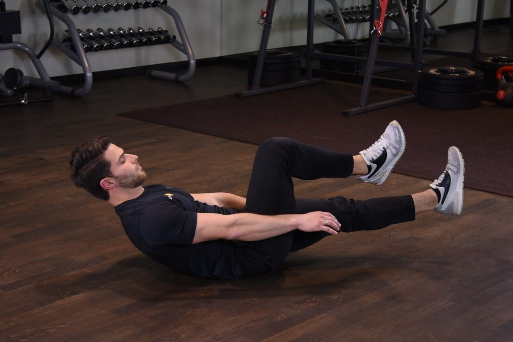 Spięcia brzucha z jedną nogą uniesioną Spięcia brzucha z jedną nogą uniesioną