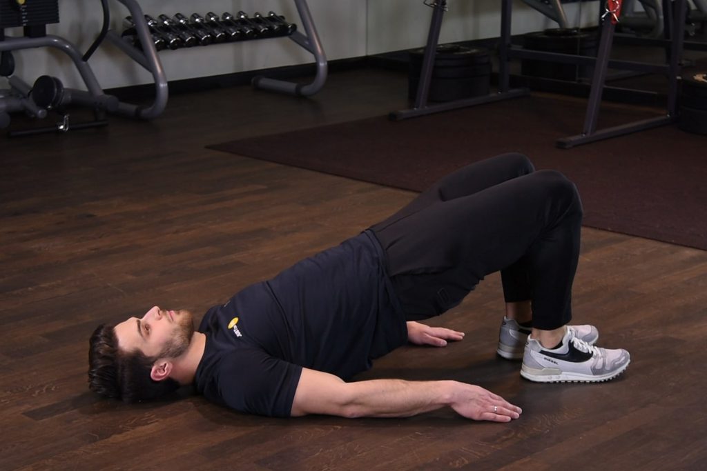Wznosy bioder w leżeniu tyłem - glute bridge Wznosy bioder w leżeniu tyłem - glute bridge